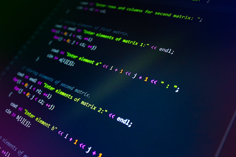 A photograph of a densely packed computer screen filled with lines of colorful computer code, including syntax highlighting that features various colors such as red, green, blue, yellow, and white on